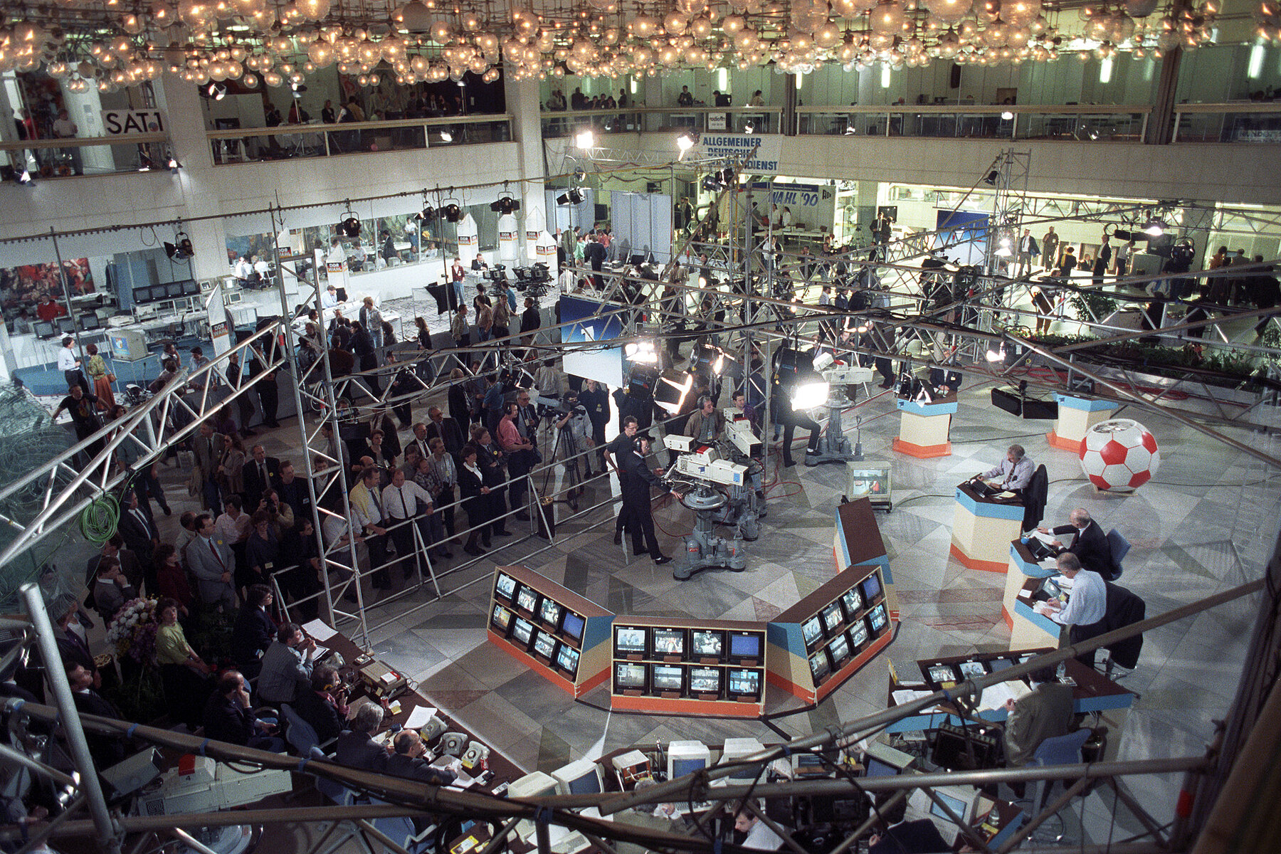 Monitors, cameras and spotlights are set up in the lobby of the Palace of the Republic.