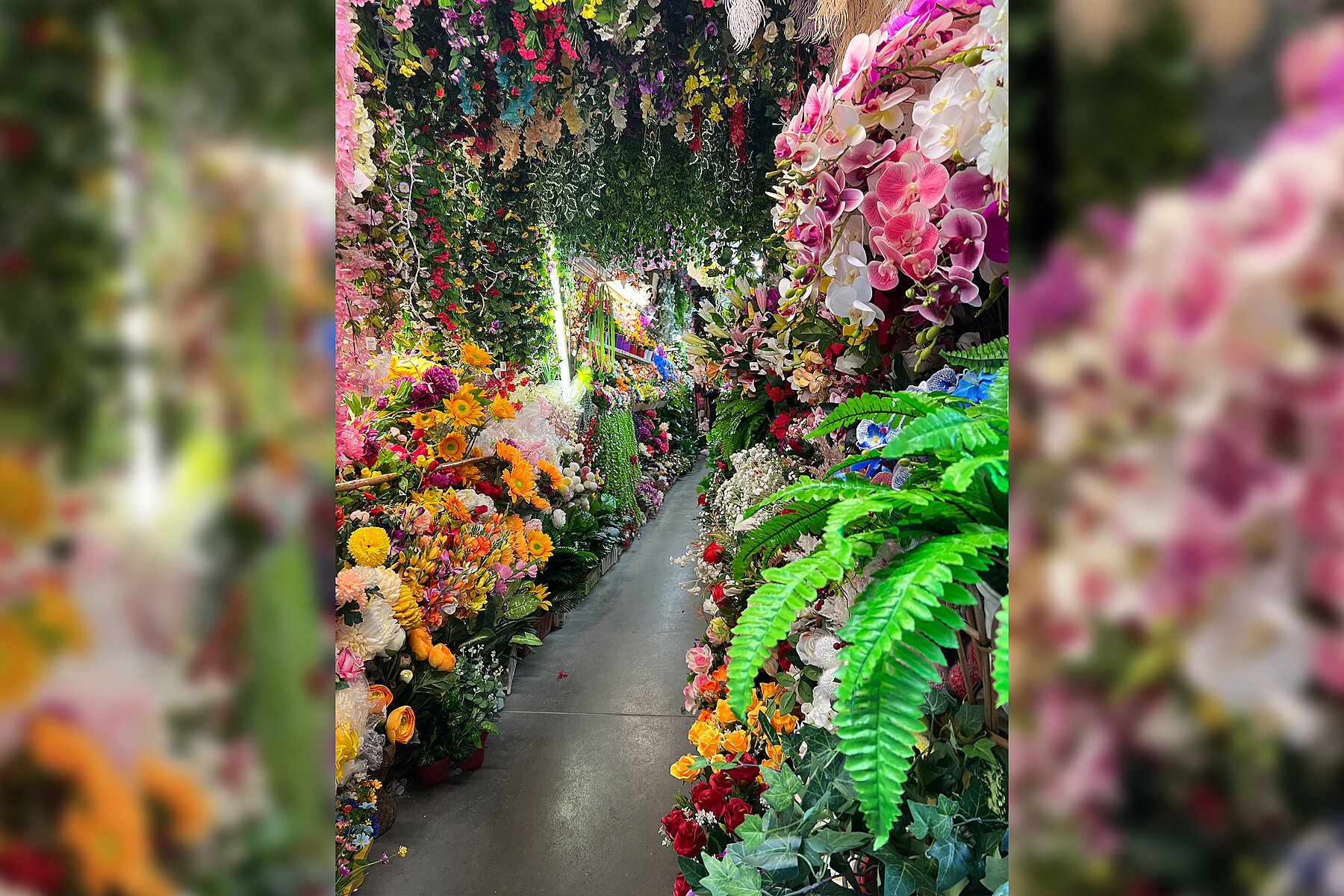 An aisle lined with flowers.