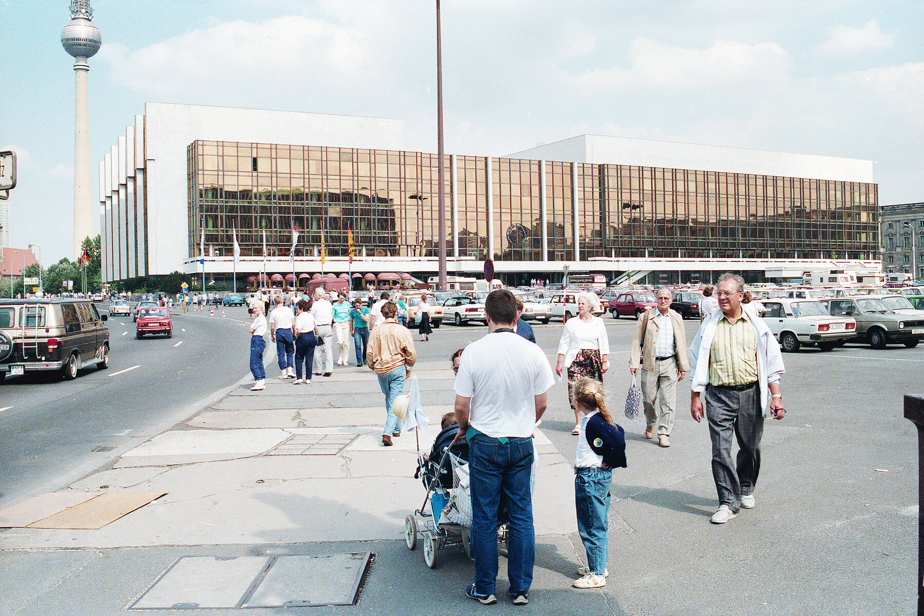 People on the street Unter den Linden in front of thePalace of the Republic.The Television Tower is in the background on the left.